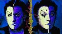 Director Federico Fellini with clown makeup